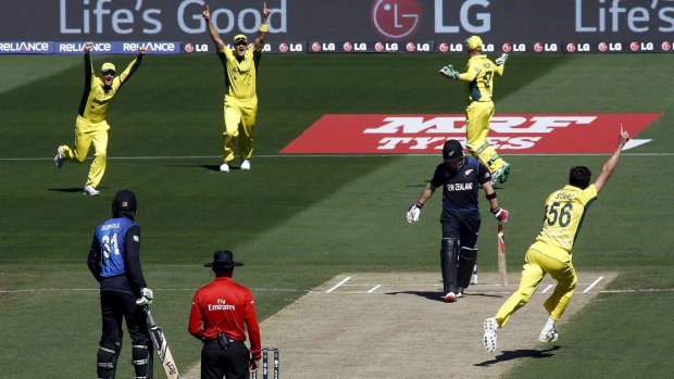 Early advantage: Mitchell Starc celebrates the crucial wicket of Brendon McCullum.