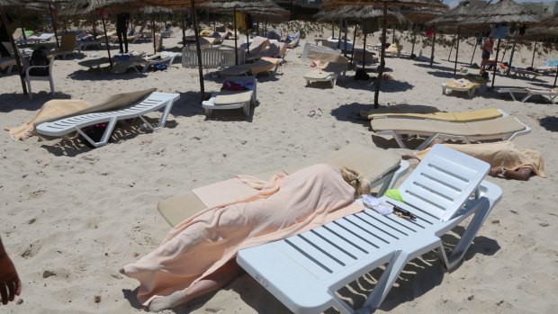 Bodies are covered on a Tunisian beach in 2015 after a young man unfurled pulled out a Kalashnikov and opened fire on European sunbathers in an attack that killed at least 28 people.
