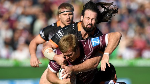 Big game: Tigers captain Aaron Woods put the disappointment of the Origin series behind him with a strong 80-minute individual performance against Manly.