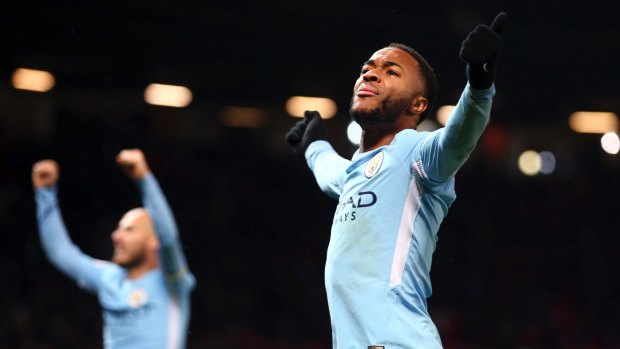 Manchester City's Raheem Sterling celebrates at the end of the English Premier League against Manchester United.