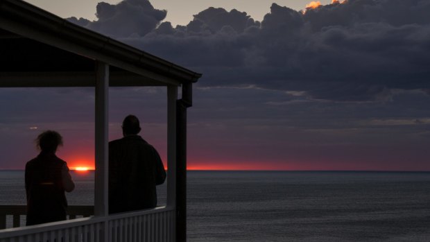 Another day: Renata and Colin Musson watch sunrise from the head lightkeeper's cottage at Wilsons Promontory lighthouse.