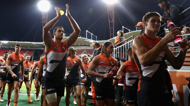 On fire: Giants players celebrate winning the round eight AFL match against the Gold Coast Suns at Spotless Stadium.