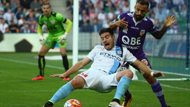 Bruno Fornaroli of Melbourne City is challenged by Diego Castro of Perth Glory.