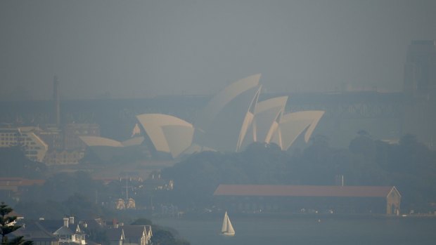 The Sydney Opera House is covered in haze from hazard reduction burns.