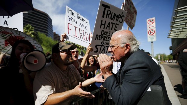 John Coulthard (right), a supporter of Donald Trump, argues with demonstrators outside a Trump campaign event in Phoenix, Arizona, last week.