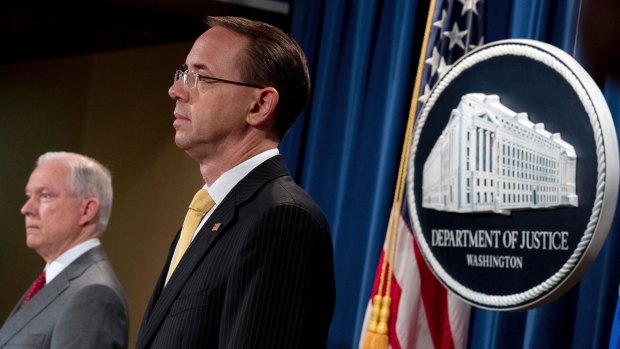 Attorney General Jeff Sessions, left, and Deputy Attorney General Rod Rosenstein, right, at a briefing at the Justice Department in Washington on August 4.