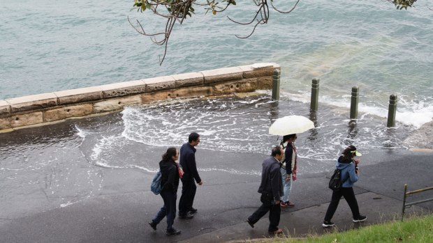 The footpath was also flooded at Mrs Macquarie Point.