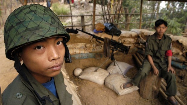 Two young ethnic Karen boys at a guard post at New Manerplaw, Myanmar, in Karen rebel territory in 2004.