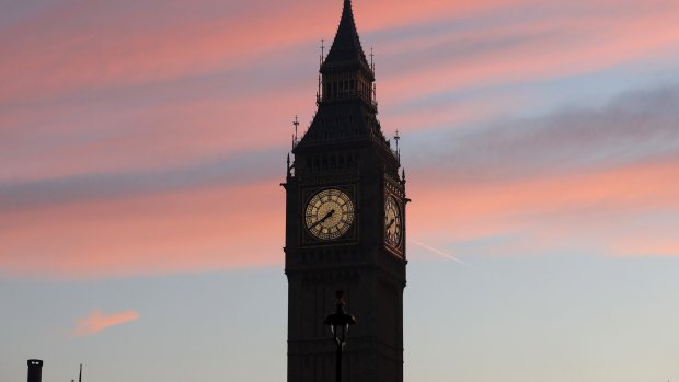 Elizabeth Tower, commonly referred to as Big Ben, stands as part of the Houses of Parliament as the sun rises in London.