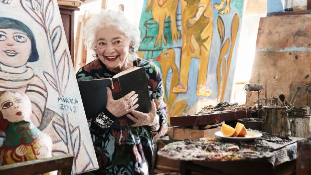 Mirka Mora in her studio wearing a Gorman dress featuring her work Naked Angel.