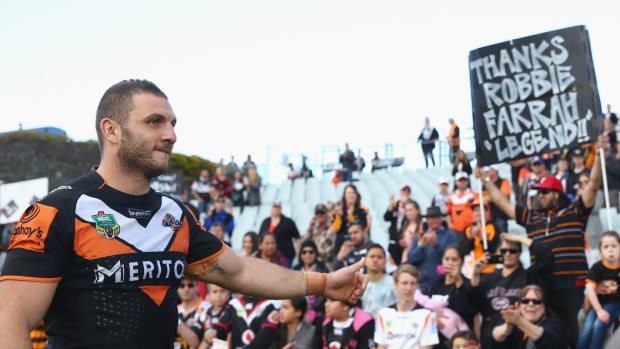 Lap of honour: Robbie Farah gestures to the crowd after the Tigers beat the New Zealand Warriors at Campbelltown Sports Stadium.