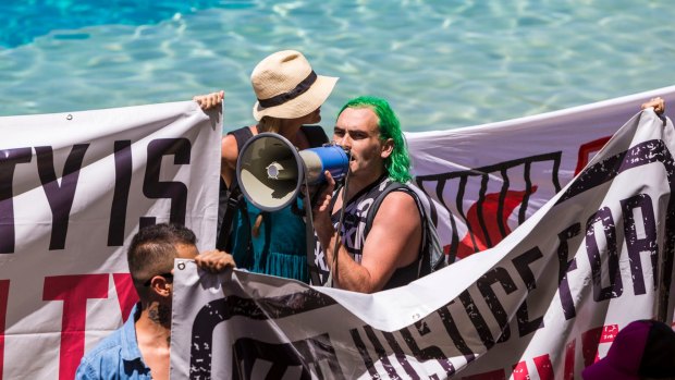 Protesters at Sea World during the dolphin show on Saturday morning. 