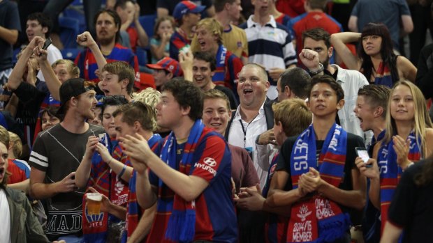 Mixing it with the fans: Jets owner Nathan Tinkler cheers his team on with fans during last month's clash with Sydney FC at Hunter Stadium.