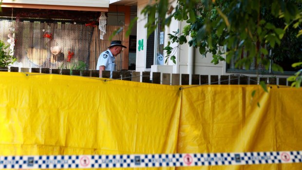 Police at the Cairns home where eight children were killed. 