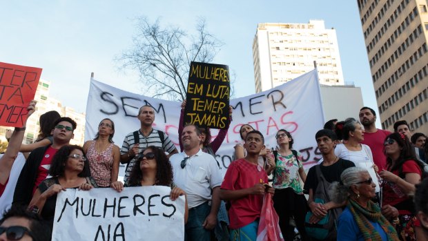 People protest the interim government of Michel Temer in Sao Paulo, Brazil, on Sunday, where some of the signs read "Women will fight" and "Never Temer" (Temer is also Portuguese for 'fear'.) 