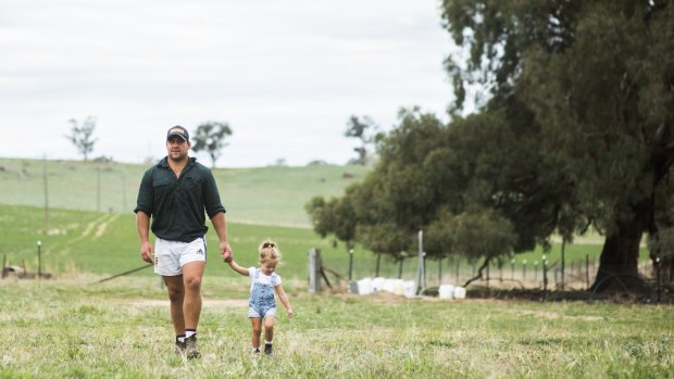 Brumbies hooker Josh Mann-Rea with his daughter Avery at home in Jugiong, NSW. 