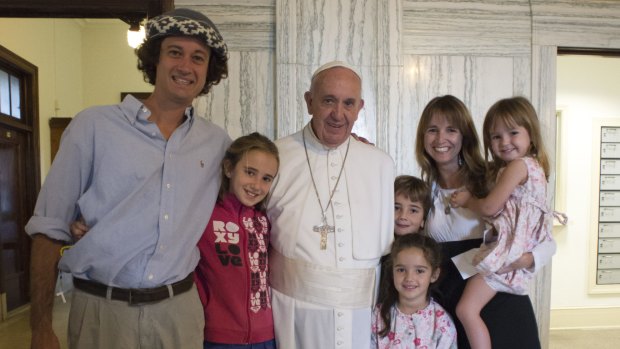 Pope Francis poses for a family photo with the Walker family, who made a 20,921-km trip over 194 days from Argentina to Philadelphia in an old Volkswagen van to attend the World Meeting of Families.