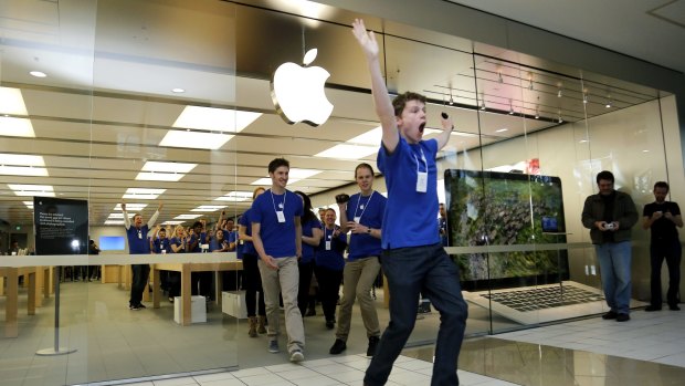 The first customers are welcomed to the opening of the Apple Store in Canberra in 2013.