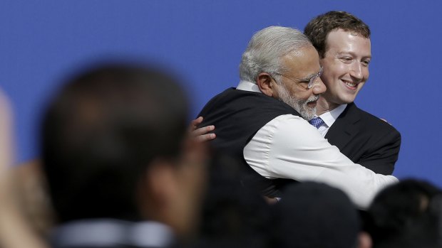 Facebook chief executive  Mark Zuckerberg (right) hugs Prime Minister of India Narendra Modi.