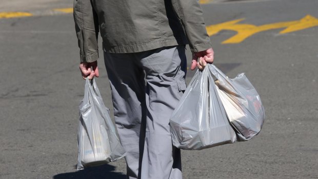 Ban the bag?: A shopper with plastic bags from a Miranda supermarket.