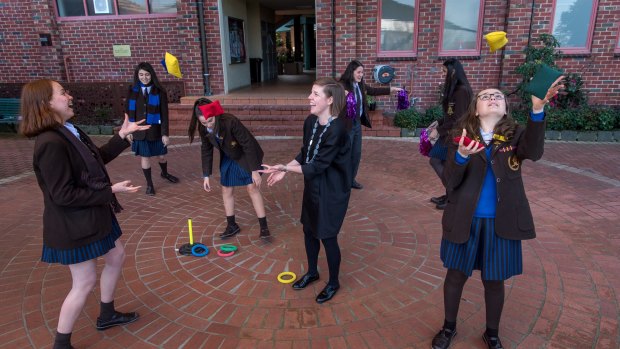 The school's head of counselling Bridget McPherson (centre) juggles with students.