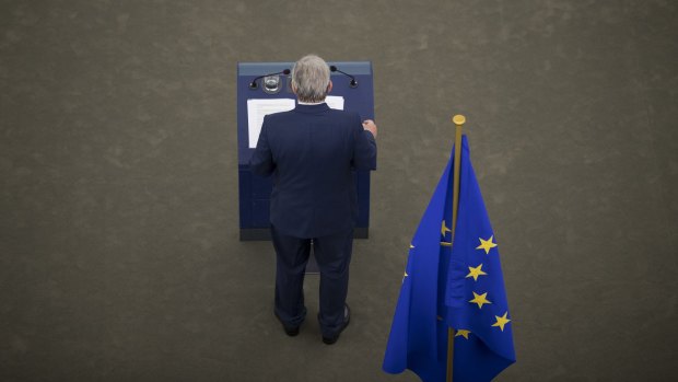 Jean-Claude Juncker stands at a podium as he delivers his state of the union speech at the European Parliament in Strasbourg, France.