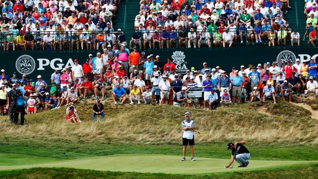 Packed gallery: Jason Day lines up a putt on the sixth hole during the final round of the 2015 PGA Championship at Whistling Straits.