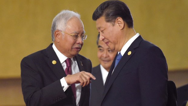Malaysian Prime Minister Najib Razak (left) with Chinese President Xi Jinping at an ASEAN summit last year.