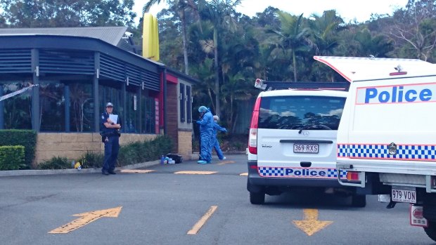 Police investigate the Helensvale McDonald's restaurant where a woman was shot dead.