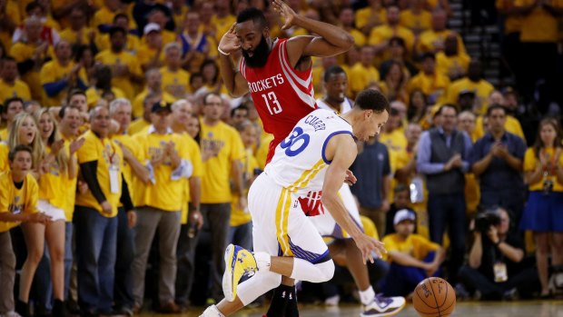 OAKLAND, CA - MAY 19:  Stephen Curry #30 of the Golden State Warriors drives against James Harden #13 of the Houston Rockets in the first half during Game One of the Western Conference Finals of the 2015 NBA Playoffs at ORACLE Arena on May 19, 2015 in Oakland, California.  (Photo by Ezra Shaw/Getty Images)