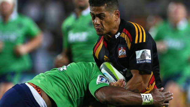Augustine Pulu of the Chiefs is tackled.