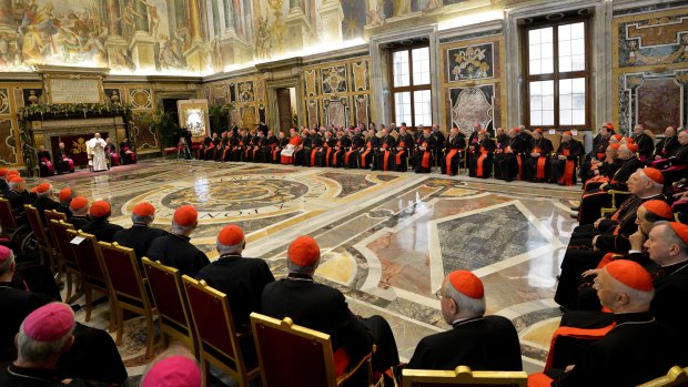 Pope Francis delivers his message during his meeting with Cardinals and Bishops of the Vatican Curia.