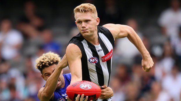 Skills loss: Adam Treloar is wearing black and white this year.