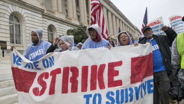 Low-wage workers, including cooks and cleaners from the Capitol, march on Capitol Hill in Washington on Tuesday.
