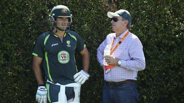 Joe Burns speaks to selector Trevor Hohns during a nets session at the SCG on Saturday.