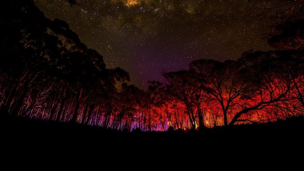 Justin McManus' photo of lights from CFA trucks during the Lancefield fires, on display at the Sydney Town Hall during the Head On Photo Festival.