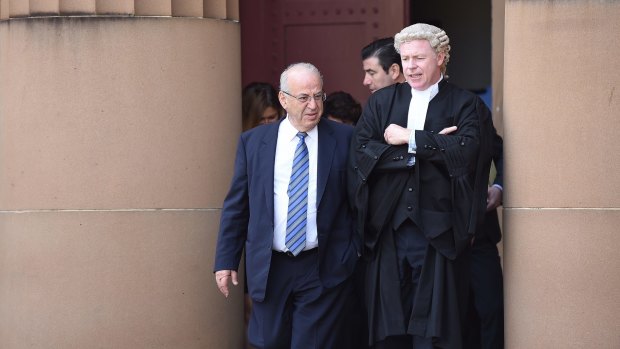 Former Labor minister Eddie Obeid, left, and junior counsel Jeffrey Tunks leave the Supreme Court during a break on the first day of the trial.