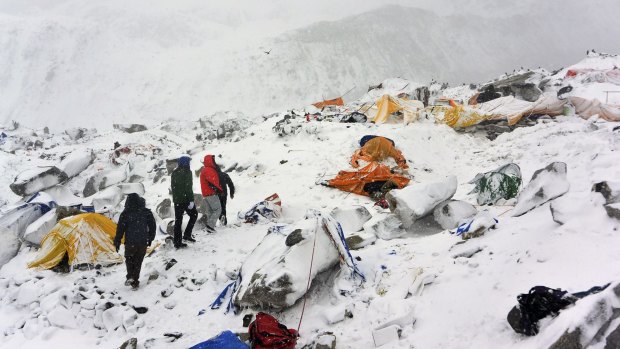 Climbers at Everest base camp search through crushed tents for fellow climbers after April's massive earthquake in Nepal.
