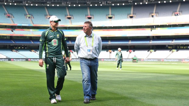 Final fling: Michael Clarke and selector Rod Marsh walk off the MCG on the eve of the World Cup final. 