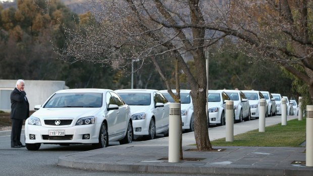COMCARS line up outside the House of Representatives.