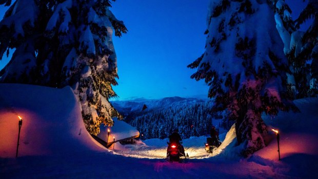 Arriving by snowmobile at the back country cabin on Mount Sproatt.