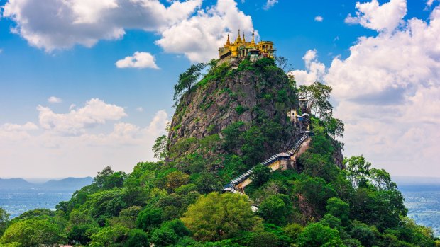 Mount Popa, Myanmar, beckons ... but the hike to the monastery is no easy stroll.