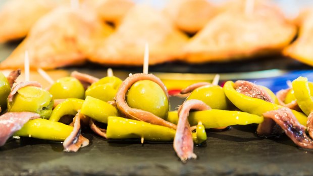 Gilda pintxos with olives are  a spicy, exotic snack found in Spain.