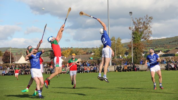 Players from hurling clubs James Stephens and Erin's Own do battle in a quarter-final clash in Ballyragget, County Kilkenny, Ireland.