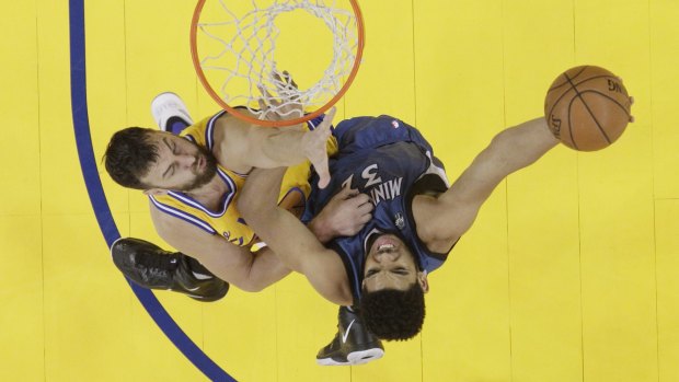 In the paint: Minnesota Timberwolves rookie Karl-Anthony Towns shoots over Golden State Warriors veteran Andrew Bogut.