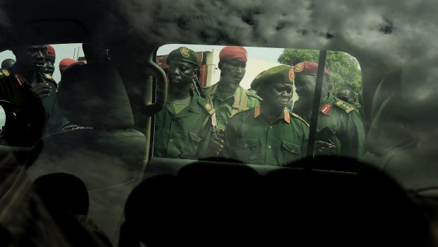 SPLA/IO Chief of General Staff Simon Gatwech Dual (second from right) arrives at Juba Airport.