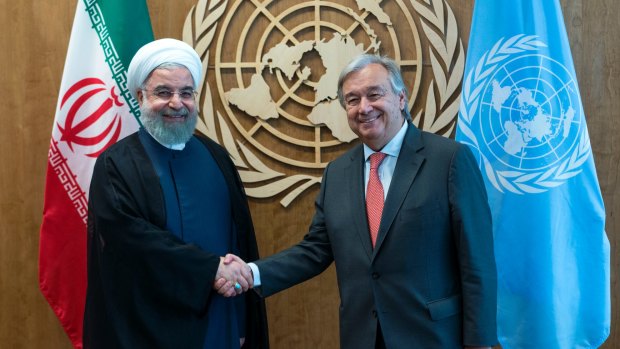 United Nations Secretary-General Antonio Guterres, right, greets Iranian President Hassan Rouhani.