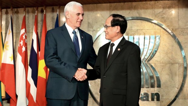 US Vice-President Mike Pence shakes hands with ASEAN Secretary-General Lee Luong Minh at the ASEAN Secretariat in Jakarta on Thursday.