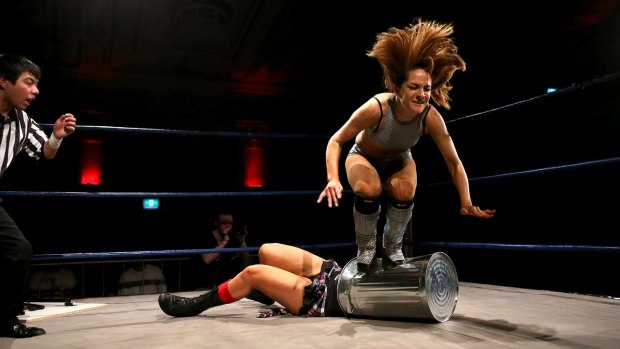 Taking out the trash: Evie stomps on Kellyanne during a Melbourne City Wrestling bout.