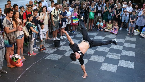 We're the best: The Young Masters break-dancing crew perform in Swanston Street.
